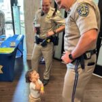 While I was only waiting to withdraw cash from the ATM, my son became best friends with two police officers.