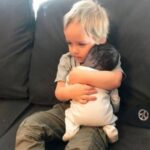 The stillborn baby was placed in his older brothers arms, seconds later, a cry echoes loudly!